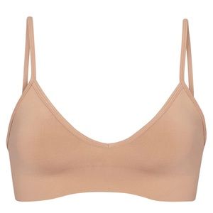 Skims Smoothing Seamless Bralette is Tan